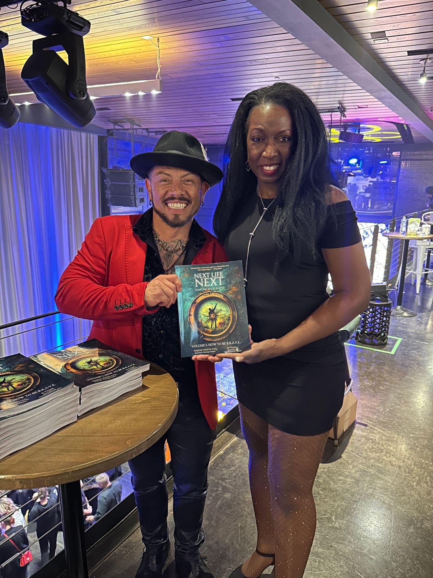 J.J. Villar and co-author Mariah Simon holding their book Next Life Next at the launch