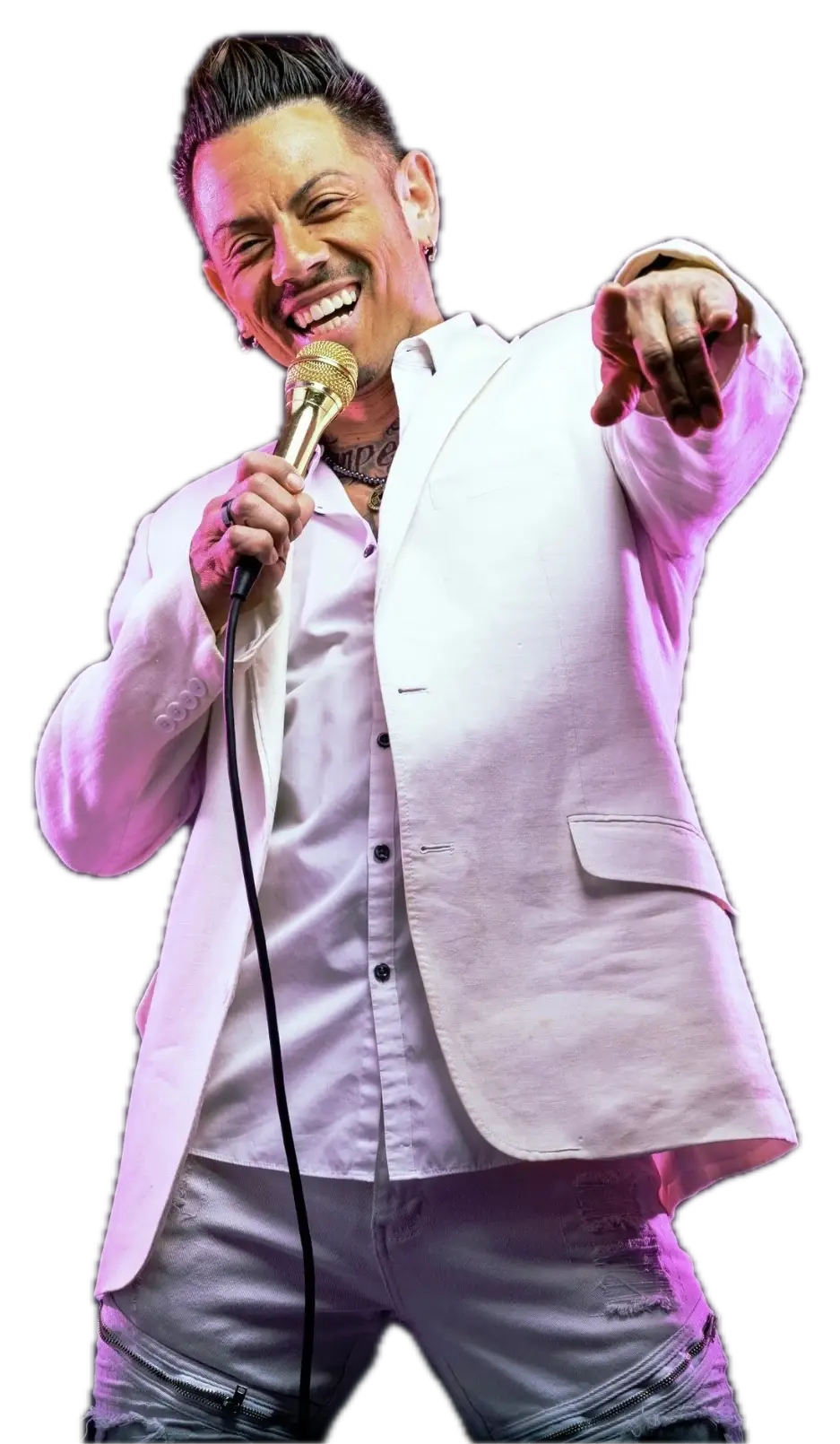 J.J. Villar in a white jacket, laughing into a gold microphone and pointing toward the audience